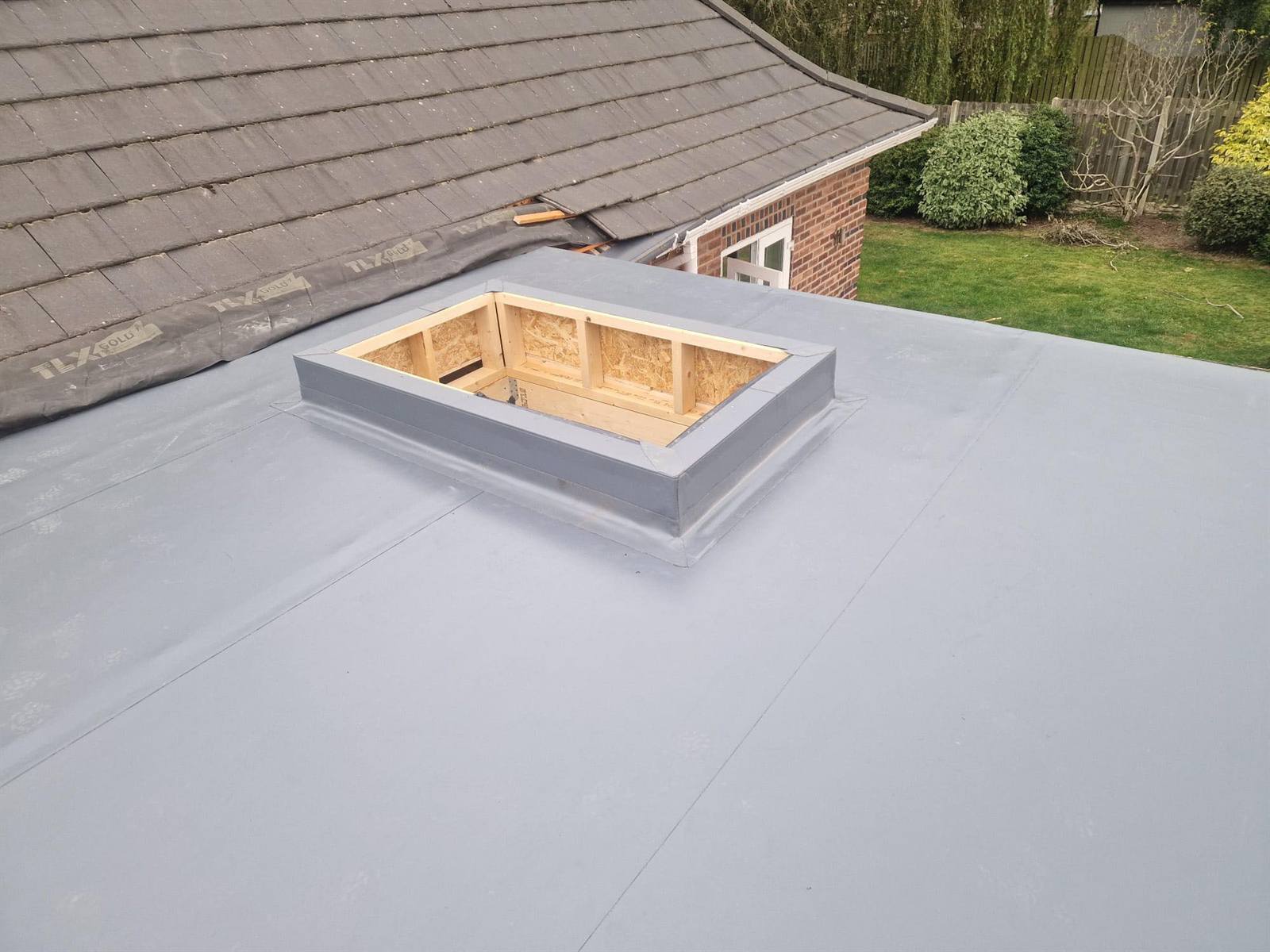 Experienced single-ply roofers at work near Rawmarsh