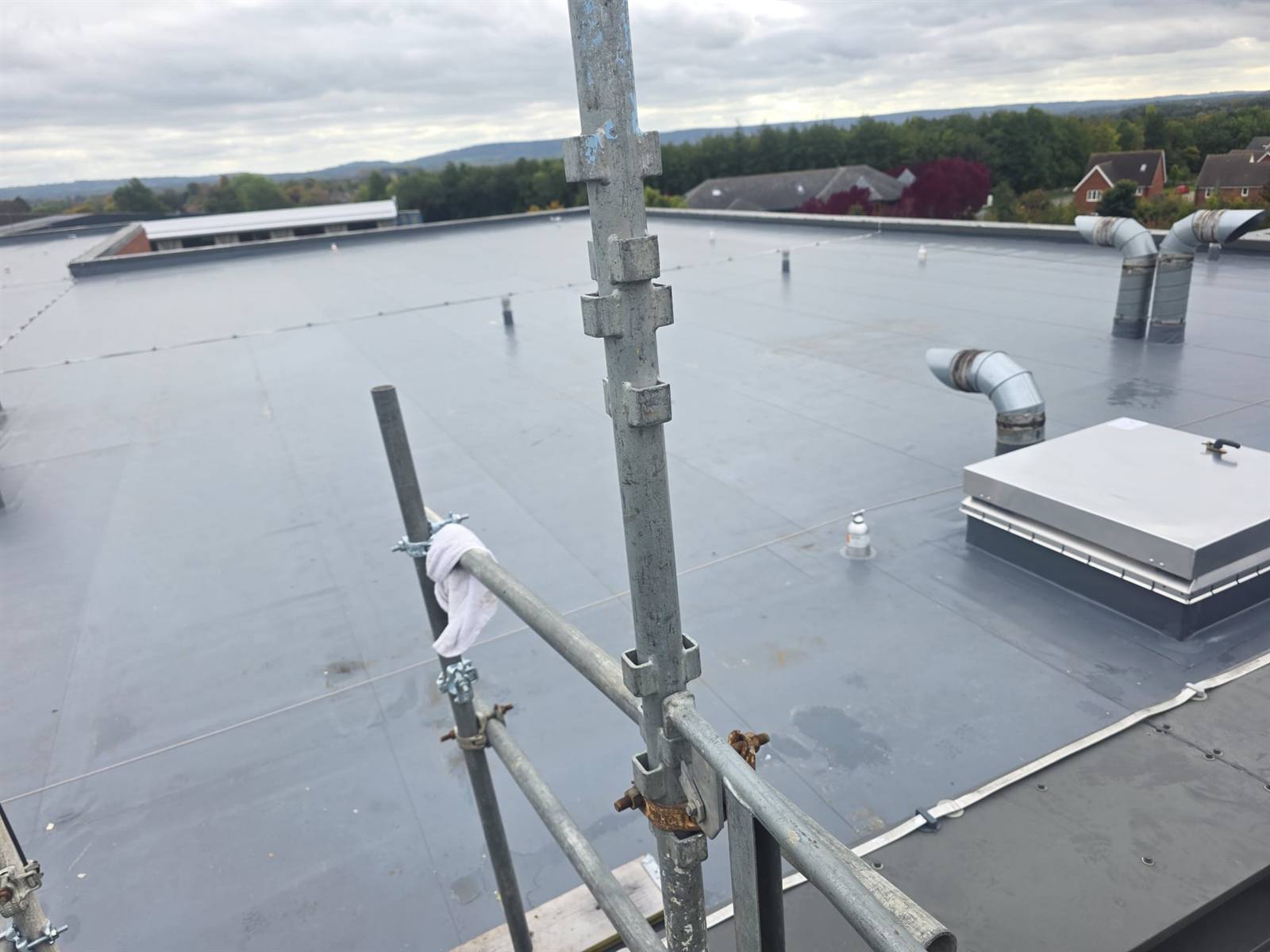 3,000 m² single-ply commercial roof overlay at a DAF site in Norfolk