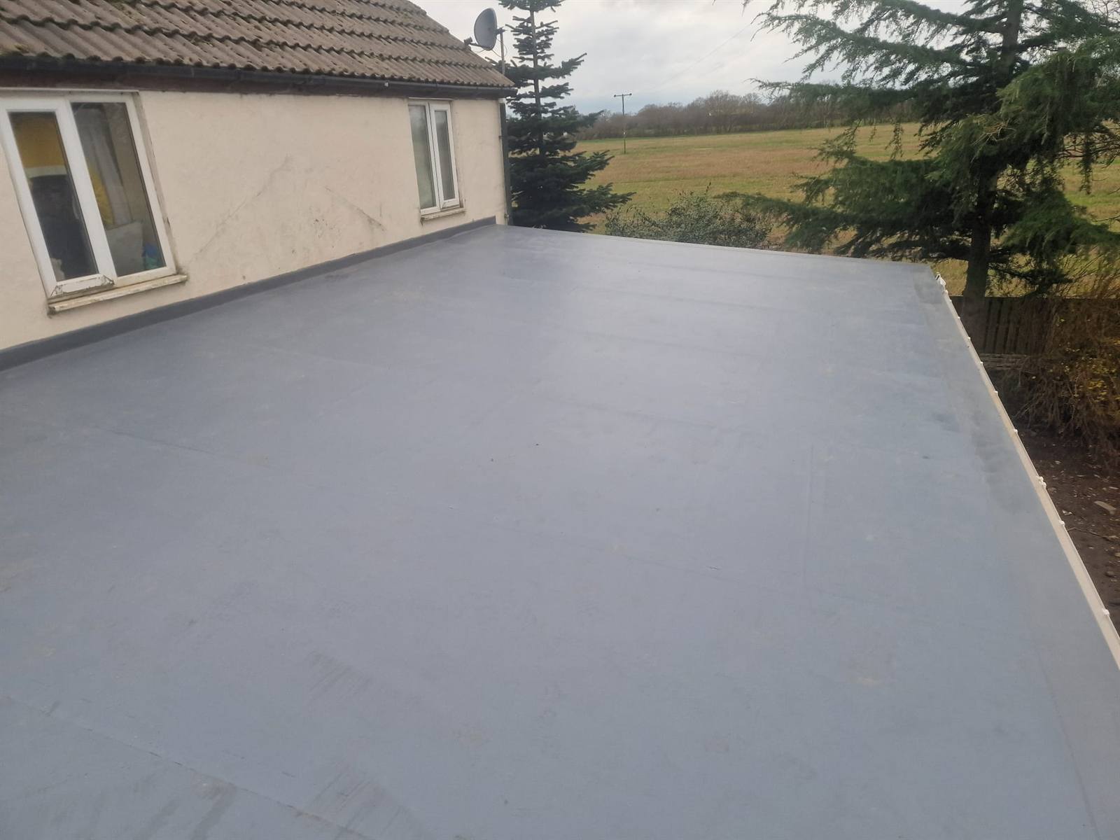 Fully-adhered Sika Sarnafil single-ply roof on a house extension in Doncaster